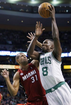 AP photo



Boston Celtics’ Jeff Green, right, shoots over Miami Heat’s Shane Battier in the first quarter of Monday night’s game in Boston.