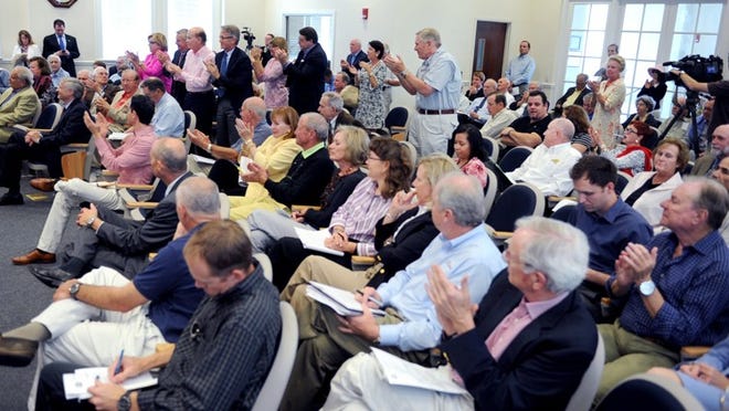 The audience reacts during a Town Council meeting when Florida Department of Transportation Secretary Ananth Prasad said the Flagler Memorial Bridge will remain open.