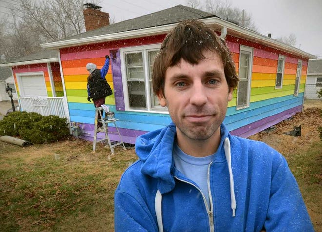 Aaron Jackson is co-founder of Planting Peace, a national nonprofit organization that on Tuesday began painting a house across the street from Westboro Baptist Church. "This isn't us trying to start a war with them or anything of that nature," Jackson said of the church that is know for anti-gay protests. "This is just, they believe one thing and we believe another. We're opposing their view." Painting in the background is volunteer Kelly Cameron.