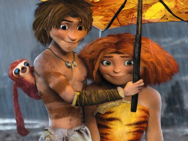 The caveman-era animated film “The Croods” features, from left, Belt the sloth (voiced by Chris Sanders), Guy (Ryan Reynolds), and Eep (Emma Stone).