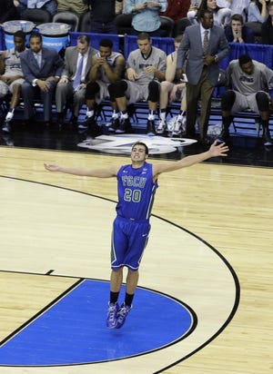 Florida Gulf Coast's Chase Fieler celebrates in the final seconds of a second-round game against Georgetown in the NCAA college basketball tournament on Friday, March 22, 2013, in Philadelphia. Florida Gulf Coast won 78-68. (AP Photo/Matt Slocum)