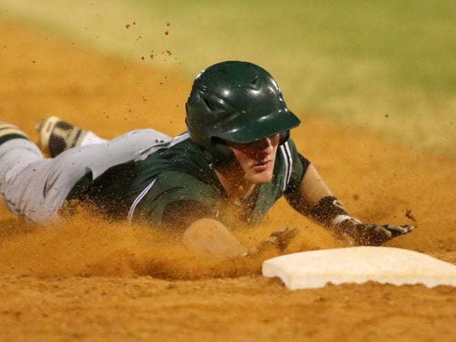 Forest's #5 Hank Truluck slides safely into third base after hitting a triple in the 3rd inning against Belleview Friday night.