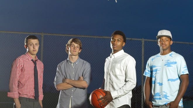 The 2013 All-Central Texas boys basketball team, gathered on the outdoor courts at Fulmore Middle School and pictured from left to right: Anderson senior John Gramlich, Anderson senior Rasmus Bach, Cedar Ridge junior De’Andre Davis and Elgin senior Trey Nash. Not pictured: LBJ junior Jahlil Tutein. Team members were outfitted in clothing provided by Billy Reid and Service Menswear.