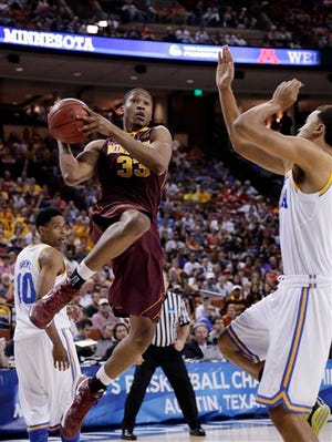 Minnesota's Rodney Williams (33) goes up for a shot as UCLA's Kyle Anderson, right, during the first half of a second-round game of the NCAA men's college basketball tournament Friday, March 22, 2013, in Austin, Texas. (AP Photo/David J. Phillip)