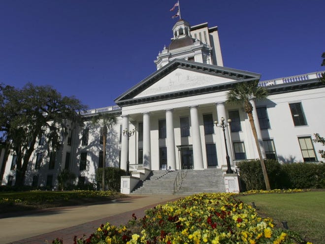 In this file photo, the Florida Capitol buildings are shown on Monday, March 4, 2013, in Tallahassee, Fla.