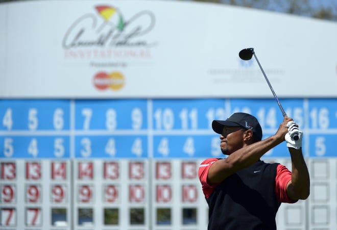 Tiger Woods watches his tee shot on the 15th hole during the final round of the Arnold Palmer Invitational golf tournament in Orlando, Fla., Monday, March 25, 2013. (AP Photo/Phelan M. Ebenhack)
