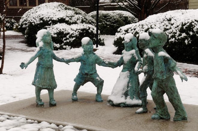 Snow covered statutes outside the Moorestown Community House Monday morning.