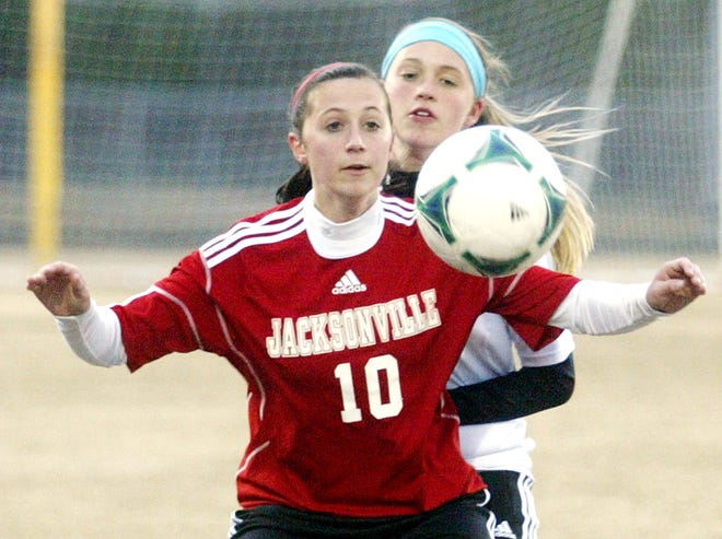 Jacksonville's Meredith McCarty plays the ball in front of Havelock's Janae Mays during the first half on Tuesday at Havelock High.