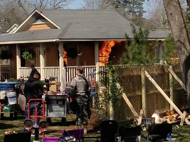 Cast and crew of 'Under the Dome' film a fire scene along Barnett Avenue in Wilmington on Wednesday.
