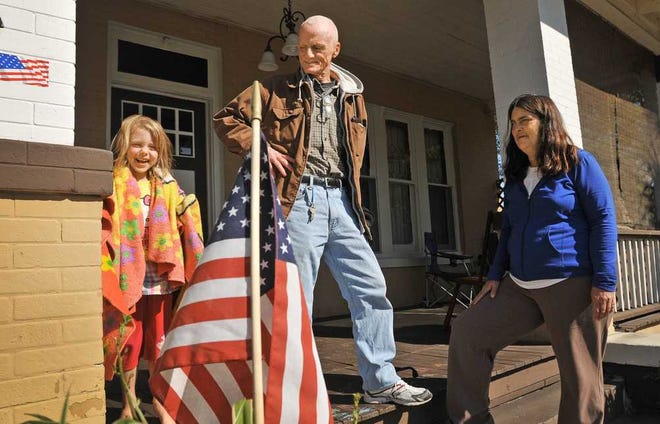 Photos by Bob.Self@jacksonville.com Johnny Reeves stands on the front porch of his family's Springfield home. Reeves, who is a Marine veteran, his wife, Melanie, and daughter, Mellie, 6, live in the Hubbard Street home, but it could be seized in the Allied Veterans case.