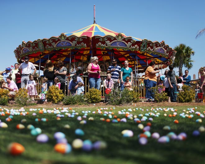 Children and parents wait to collect eggs during an Easter egg hunt at Pier Park in Panama City Beach on Saturday.