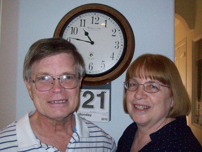 Steve Newport, left, who has Alzheimer's, and his wife, Dr. Mary Newport, are shown in a family photo.