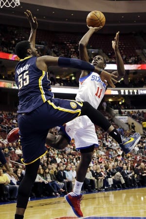 The 76ers' Jrue Holiday (11) shoots over the Pacers' Roy Hibbert during the first half of a Feb. 6 game at the Wells Fargo Center.