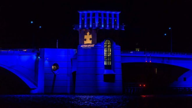 The Royal Park Bridge was lit blue to recognize the Autism Speaks organization Saturday, March 23, 2013. (Thomas Cordy/The Palm Beach Post)
