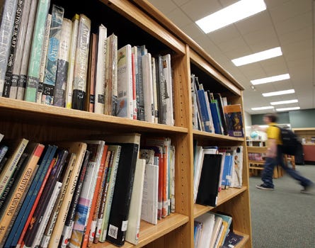 A student enters the library at Jinks Middle School in Panama City on Monday. April is School Library Month.