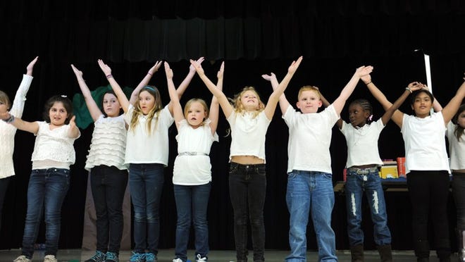 Members of a chorus group perform during Palm Beach Public Afterschool Arts Program’s recent Grand Finale.