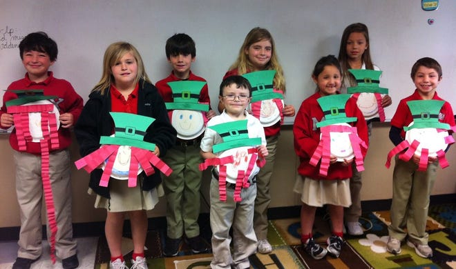 MAX Charter School first-graders (front row, from left) Autumn Rhodes, Gauge Knight, Mia Folse and Holden Wempren; and (back row, from left) Jacob Lashover, Ian David, Kaila Bergeron and Rilyn Billiot display their leprechauns in celebration of St. Patrick's Day in Laquishia Trahan's classroom on the Thibodaux school's campus.