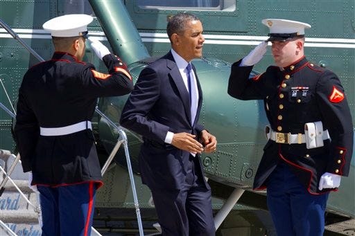 Marines salute as President Barack Obama jogs off of the Marine One helicopter before boarding Air Force One at Andrews Air Force Base, Md., Wednesday April 3, 2013, en route to Colorado.