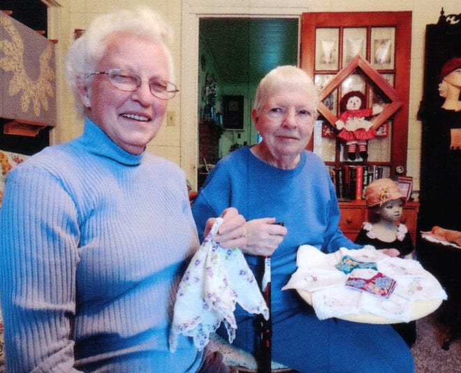 Mildred Guthrie (left) and Nannie Lou McBane look over some of the vintage ladies handkerchiefs which will be displayed at the 82nd annual Uncle Eli’s Quilting Party on April 4.
