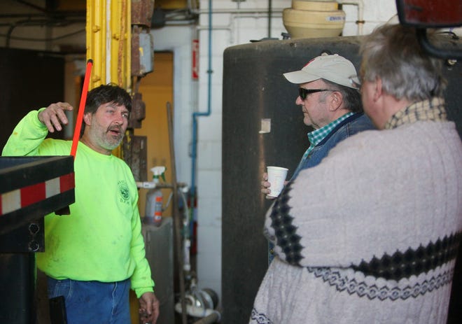 Joe Collins mechanical equipment operator gives a tour of the inner working of the DPW building at the recent annual open house.
