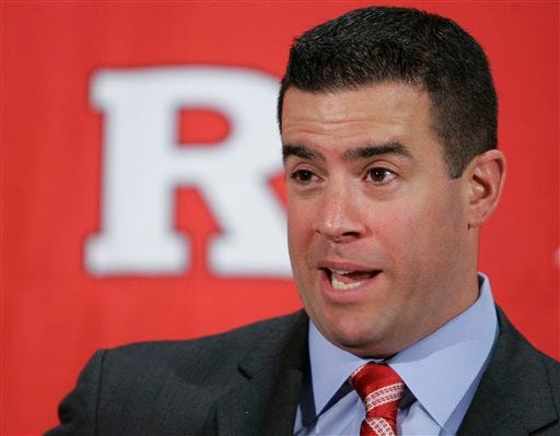 In this Feb. 26, 2009 file photo, Tim Pernetti speaks to reporters after he was named the new athletic director at Rutgers University during a news conference on the university campus in Newark, N.J. A person familiar with the decision says Pernetti is out as Rutgers athletic director. The person spoke on condition of anonymity because an official announcement has not been made yet. The school will hold a press conference on campus at 1 p.m. Friday, April 5, 2013. Pernetti dismissed basketball coach Mike Rice Wednesday after a videotape aired showing him shoving, grabbing and throwing balls at players in practice and using gay slurs. The scandal has now cost Pernetti his job some five months after he didn't fire Rice when the video first became available.