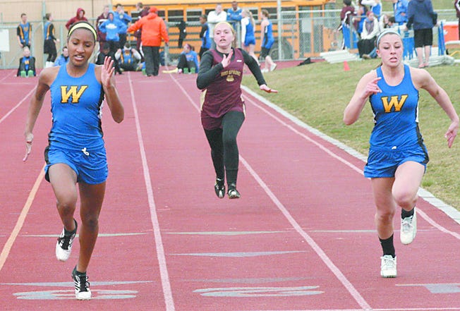 Waynesboro's Kiki Hodge-Shindledecker (left) and teammate Jade Swope take first and second in the 100. Hodge-Shindledecker also won the 200 and both ran on the winning 400 relay team.