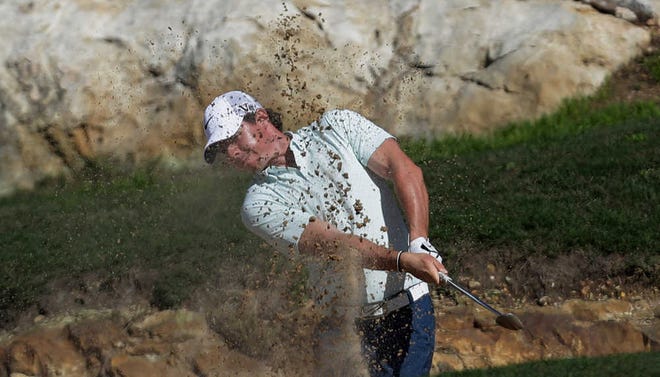 Rory McIlroy hits from the sand on the 14th hole during the Texas Open on Friday in San Antonio.