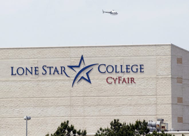 A police helicopter circles above the Cy-Fair campus of Lone Star Community College in Cypress, Texas, where officials say about a dozen people have been wounded in a stabbing attack Tuesday, April 9, 2013. The Harris County Sheriff's department confirmed that authorities have one suspect in custody. 

(AP Photo/Houston Chronicle, Melissa Phillip)