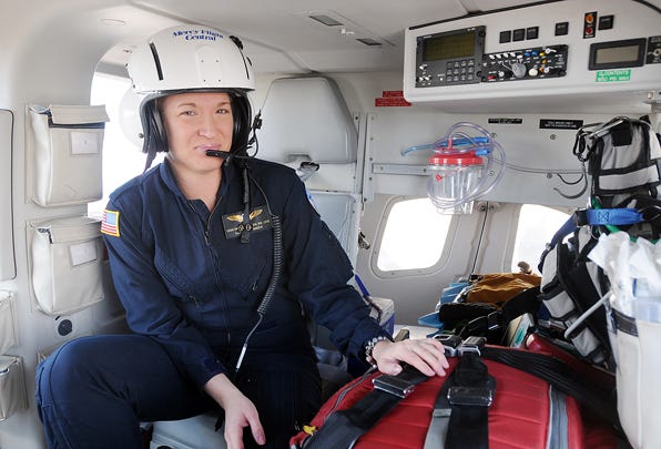 Erin VanZummeren, of Canandaigua, is pictured in one of the helicopters at Mercy Flight Central in Canandaigua.