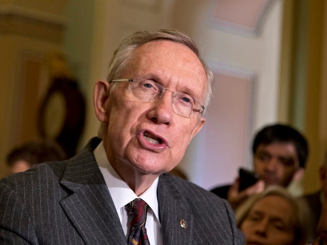 Senate Majority Leader Harry Reid, D-Nev., speaks with reporters following a Democratic strategy session at the Capitol in Washington on Tuesday. Reid said he plans showdown vote on gun control on Thursday. (AP Photo/J. Scott Applewhite)