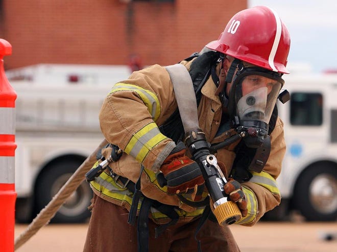 Lt. Brandon Roberts, a paramedic for Tuscaloosa Fire and Rescue Service, trains for the Firefighter Combat Challenge in 2011.