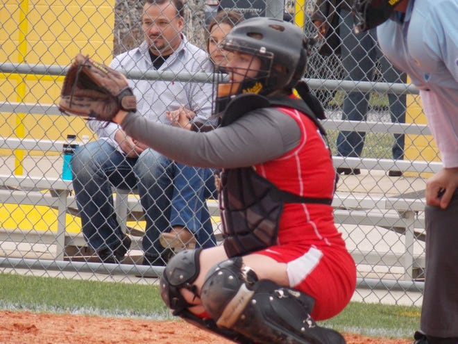 Senior catcher Kayla Hernandez sits behind the plate in the team’s loss at St. James this season.