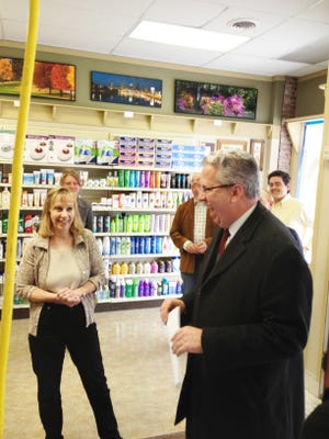 Ann Ritzler, owner/pharmacist of Naples Apothecary, shares a laugh with state Sen. Ted O'Brien, D-Irondequoit on Friday. The new pharmacy opens April 10, 2013.