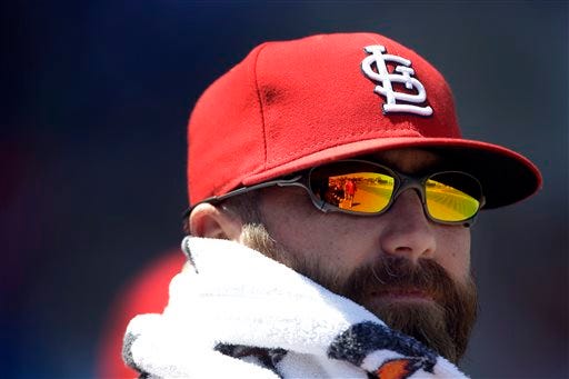 St. Louis Cardinals closer Jason Motte watches from the dugout during the fourth inning of an exhibition spring training baseball game against the New York Mets Friday, March 29, 2013, in Port St. Lucie, Fla. (AP Photo/Jeff Roberson)