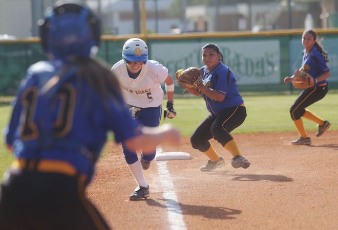 Gulf Coast’s Katie White heads for home and scores in the second inning of the Lady Commodores’ 9-2 win over Tallahassee in the first game of a doubleheader Wednesday.