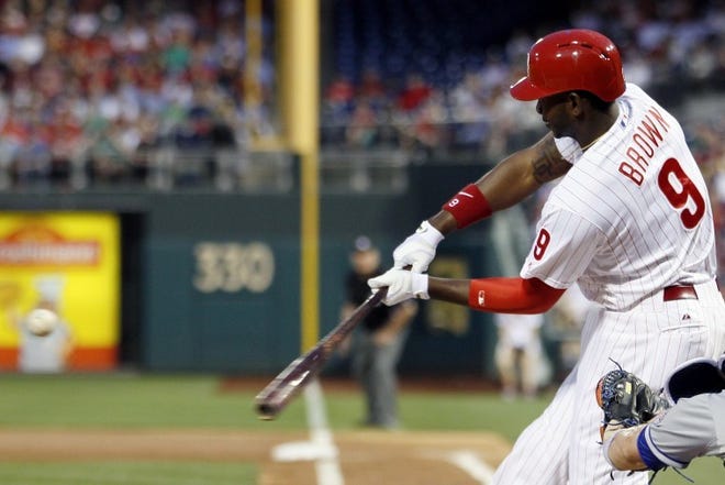Philadelphia's Domonic Brown connects for a three-run home run during the first inning of Wednesday's game against the New York Mets in Philadelphia.