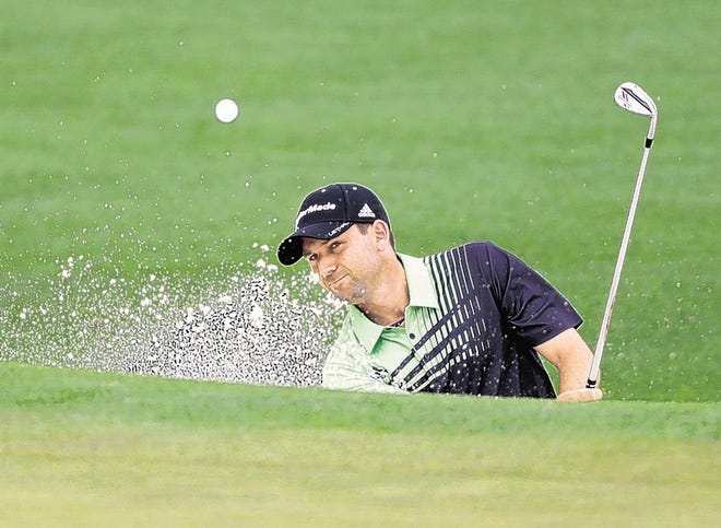 Sergio Garcia, of Spain, chips out of a bunker on the second green during the first round of the Masters golf tournament Thursday, April 11, 2013, in Augusta, Ga. (AP Photo/David Goldman)