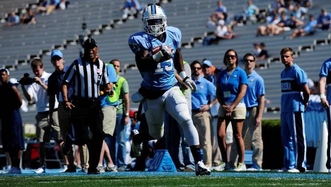 North Gaston product A.J. Blue runs for a TD during UNC’s spring scrimmage day on Saturday.