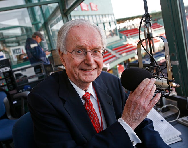 Fenway Park public address announcer Dick Flavin of Quincy sits behind the mike at the home opener for the Red Sox on Monday, April 8, 2013.
