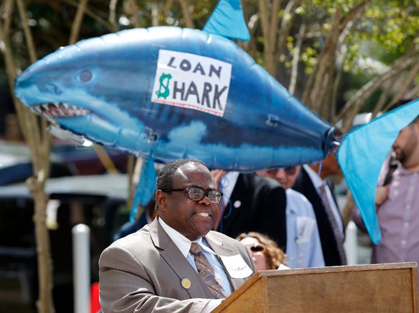 The Rev. Hugh Morals speaks out against a pay day loan bill during a rally attended by several dozen demonstrators at the Alabama Statehouse in Montgomery, Ala., Tuesday, April 2, 2013. The pay day loan is expected to come up before the Senate sometime soon. (AP Photo/Dave Martin)