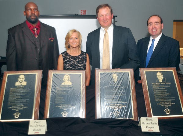 The Etowah County Sports Hall of Fame inducted its newest members Saturday night. From left, Jason Ivey, Kim Welch Nails, Dr. Lucian Newman III and Tim Wilson, the son of inductee Max Wayne “Barto” Wilson, pose for a photo.
(Dave Hyatt | Gadsden Times)