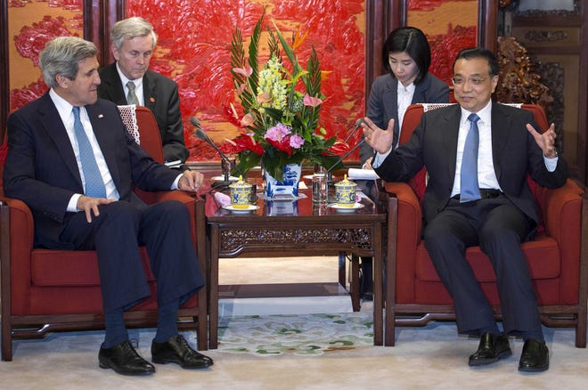 U.S. Secretary of State John Kerry, left, listens to Chinese Premier Liu Keqiang during their meeting at the Zhongnanhai Leadership Compound Saturday, April 13, 2013 in Beijing. The question of how Washington can persuade Beijing to exert real pressure on North Korean leader Kim Jong Un's unpredictable regime is front and center as Kerry meets Saturday with Chinese leaders in Beijing. (AP Photo/Paul J. Richards, Pool)
