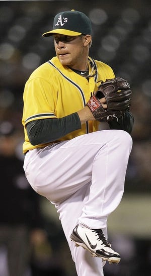 Shawnee's Sean Doolittle needed just 21 pitches to record four outs in his first major league outing for the A's on Tuesday. (AP Photo/Ben Margot)