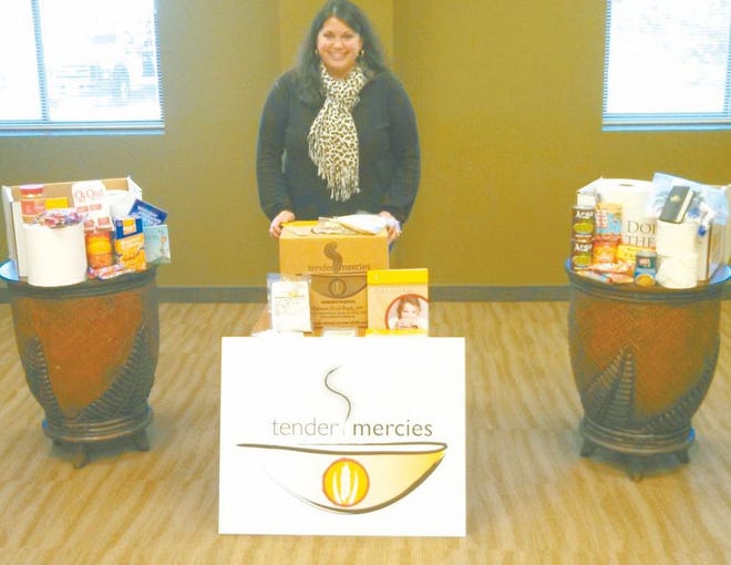 Julie Brooks from the Midwest Food Bank in Peoria came and addressed the FEEDco organization at its March meeting. She is shown here with a Salvation Army disaster box and the ‘Tender Mercies’ soup-based meal the food bank includes in them.