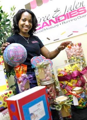 Sheila Johnson shows some of the candy goodies offered online.