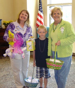 Easter fun: Members of Lee's Legacy Children of Confederacy 946 recently filled bags of "Bunny Poop" aka miniature pastel marsh mellows and delivered to the 120 residents of the Clyde Lassen Nursing Home for Easter. They also donated two fun-filled Easter baskets for a raffle. Lee's Legacy is sponsored by the Ancient City Chapter United Daughters of the Confederacy 2232 under director Judy Davis. Pictured, from left are Diane King, Evan Stroud and Judy Davis. Contributed photo.