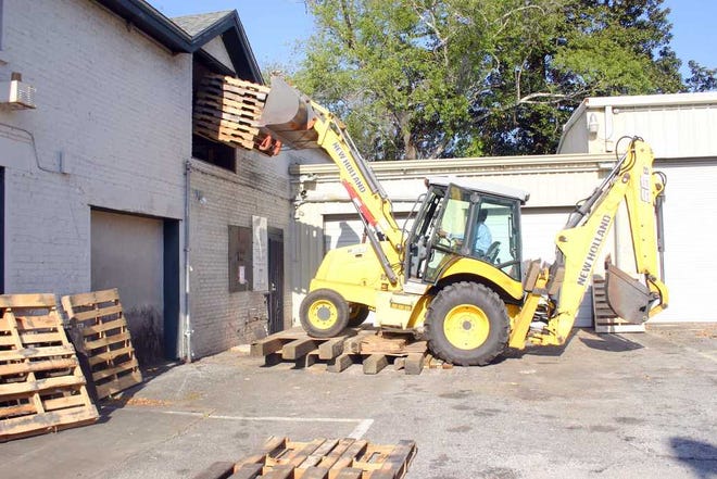 Photo provided by Savannah-Chatham police A front-end loader is used as a forklift during the moving process.