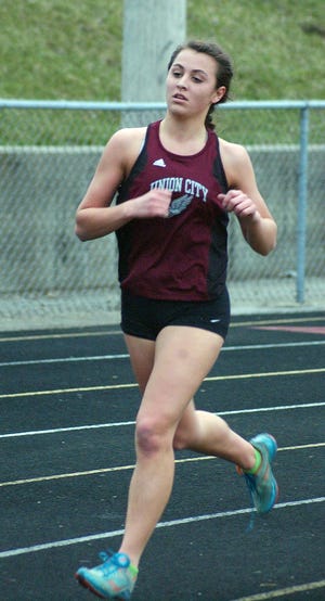 Union City's Katie Birch, who won a pair of events on Monday, runs in the 3200 meter race. Gary Baker Photo