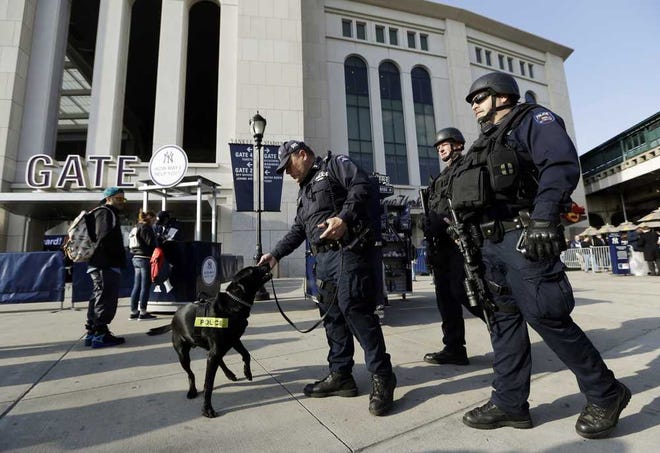 Kathy Willens Associated Press Police officers patrol in front of Yankee Stadium before Tuesday's game between the Yankees and Diamondbacks in New York. Signs of increased security were visible in the wake of the Boston Marathon explosions.