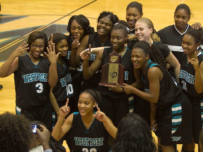 FILE PHOTO - West Port High School celebrates and has their picture taken with district trophy after defeating Citrus High School in the Girls District 6A-6 championship game in 2912.